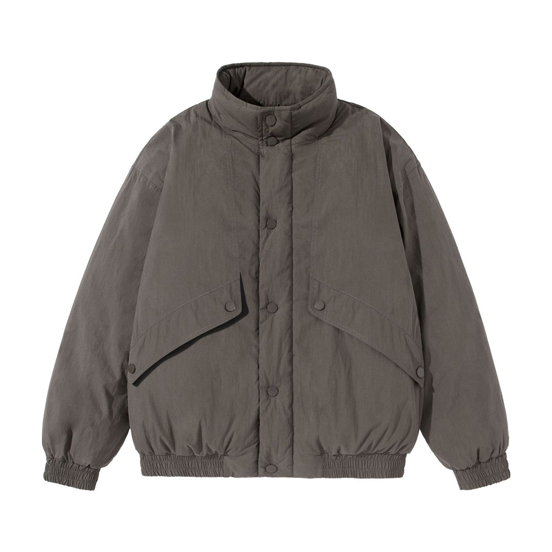 Unisex Kurz geschnittene gesteppte Boxy‑Blousonjacke mit hohem Stehkragen und Utility‑Flaptaschen Shop Nory