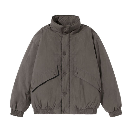 Unisex Kurz geschnittene gesteppte Boxy‑Blousonjacke mit hohem Stehkragen und Utility‑Flaptaschen Shop Nory