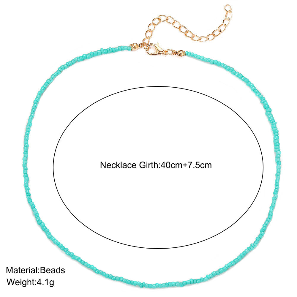 Damen zarte Halsschmuckkette mit bunten Perlen und goldenen Akzenten Shop Nory