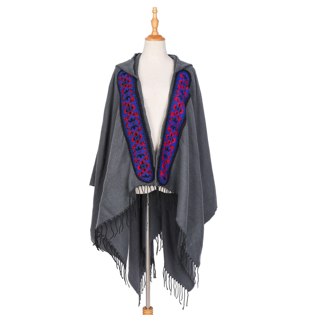 Damen Kapuzenponcho aus Wollmix mit kontrastreicher Blumenstickerei und Fransensaum Shop Nory