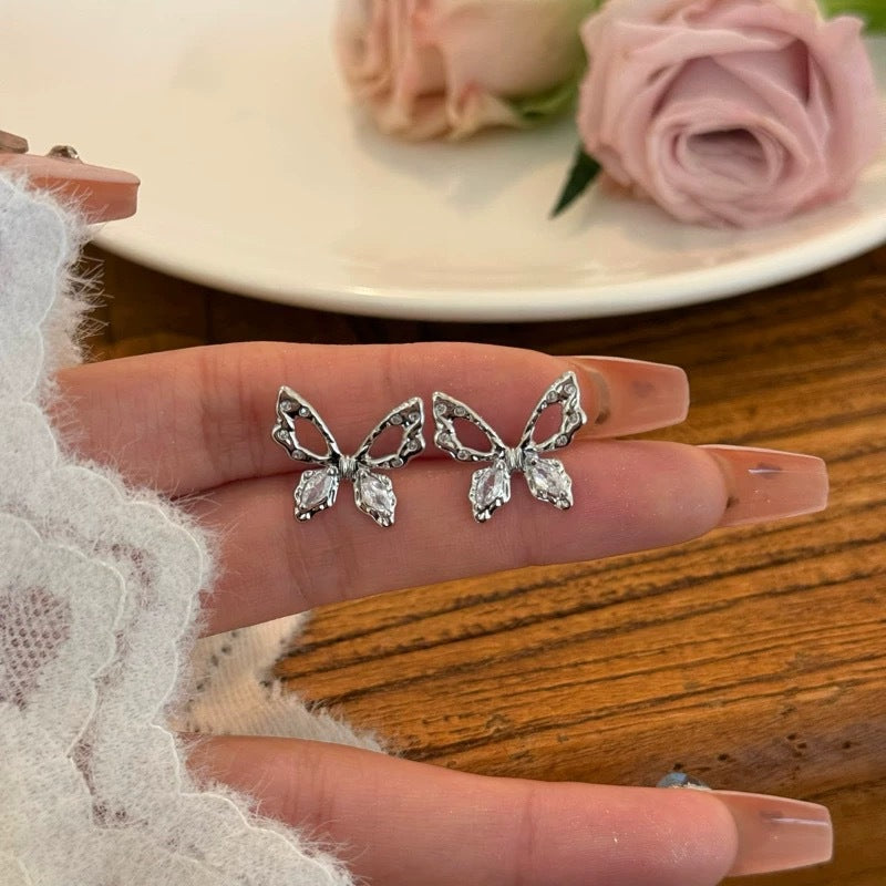 Damen Ohrstecker im Schmetterlingsdesign mit funkelnden Zirkonia Shop Nory
