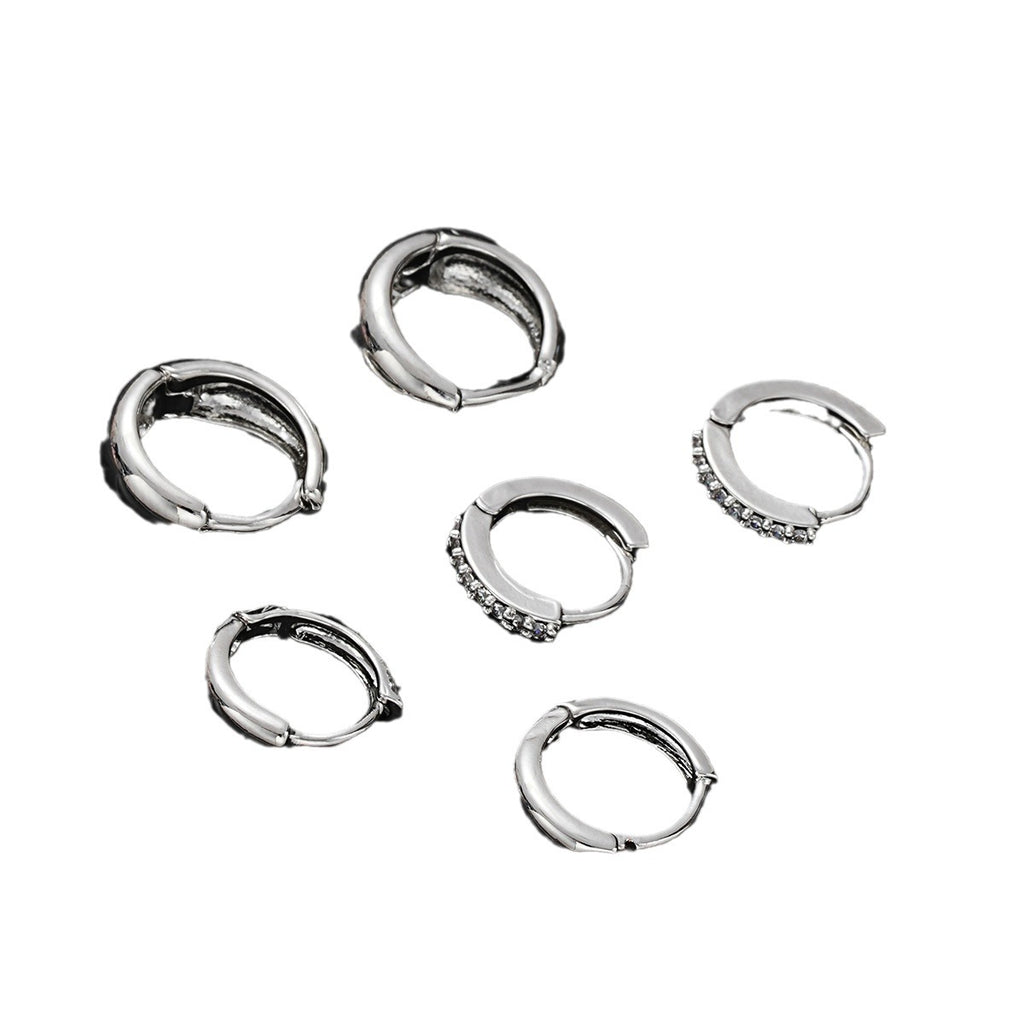 Damen Ohrringe mit funkelnden Zirkonia und geschwungenem Design Shop Nory