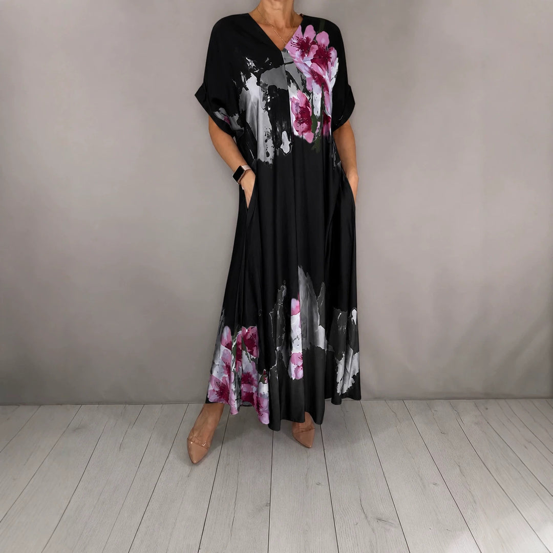 Damen Maxikleid mit weitem Fall, V-Ausschnitt, Eingrifftaschen und floraler Aquarelloptik Shop Nory