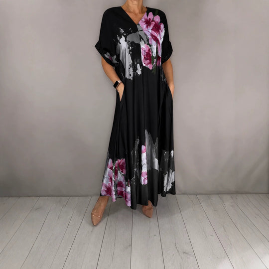 Damen Maxikleid mit weitem Fall, V-Ausschnitt, Eingrifftaschen und floraler Aquarelloptik Shop Nory