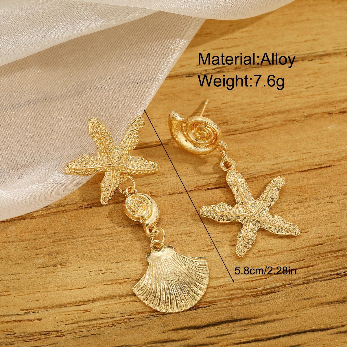 Damen Ohrringe mit maritimem Muschelmotiv und funkelnden Akzenten Shop Nory