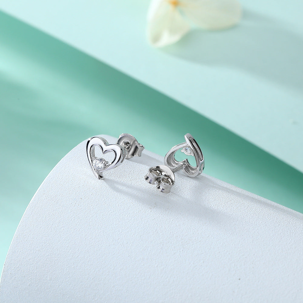 Damen Ohrringe im Herzdesign mit funkelnden Zirkonia Shop Nory