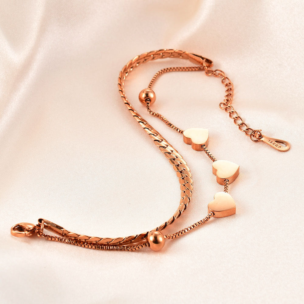Damen Armband mit elegantem Herzdesign und feinen Kettengliedern Shop Nory