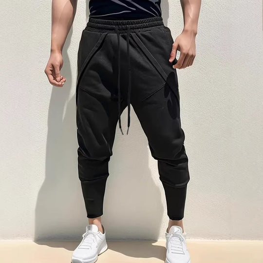 Herren Tapered-Jogginghose mit tiefem Schritt, elastischem Bund & diagonalgesetzten Taschen Shop Nory