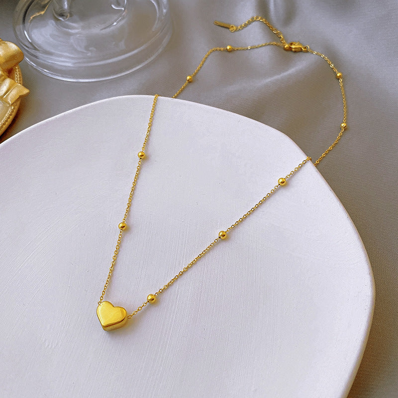 Damen Halskette mit herzförmigem Anhänger und zarten Details Shop Nory
