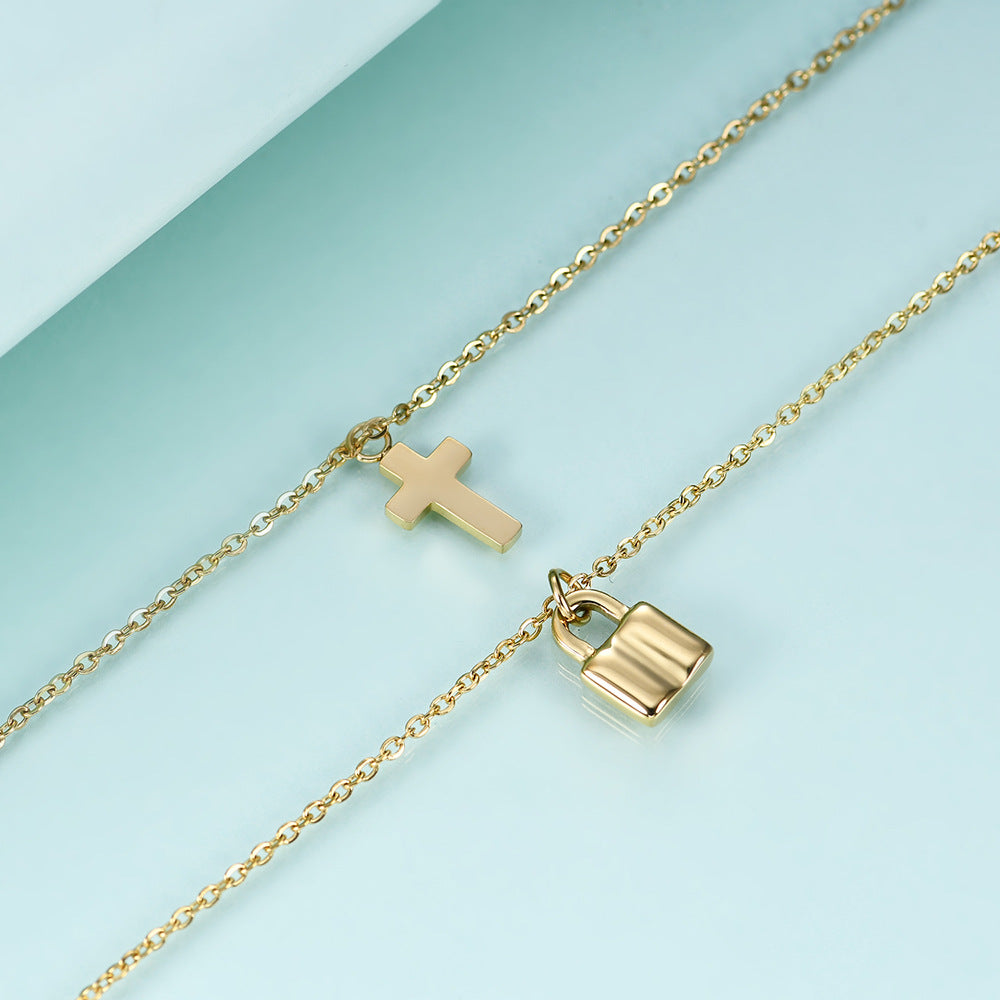 Damen Halskette mit doppeltem Anhänger in Form eines Kreuzes und eines Schlosses Shop Nory
