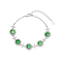 Damen Armband mit funkelnden Kristallen und grünem Edelstein Shop Nory