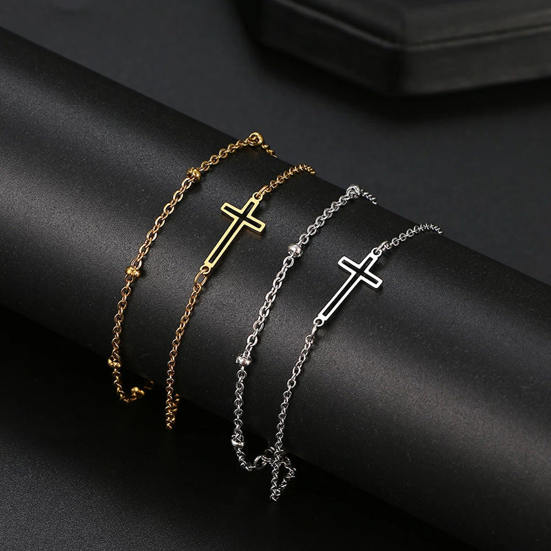 Damen Armband mit filigranem Kreuzdesign und elegantem Kettenspiel Shop Nory