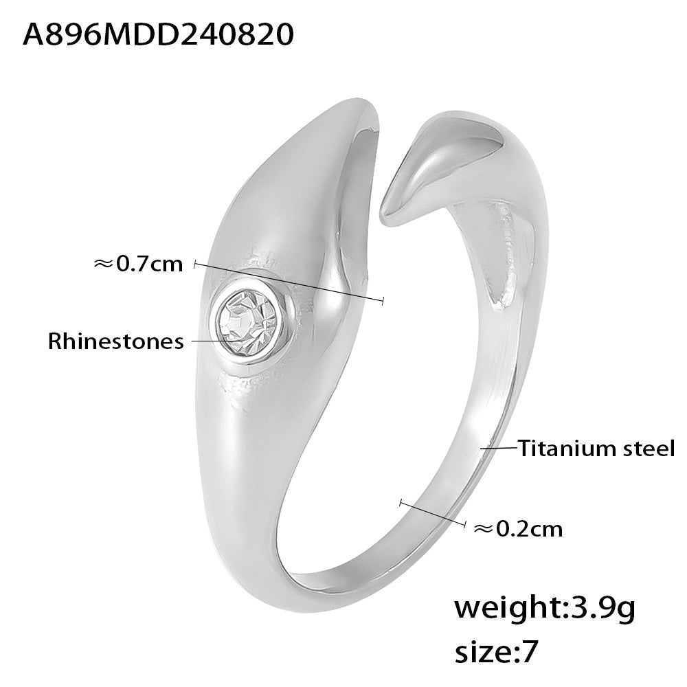 Damenring mit schickem Wellen-Design aus Titanstahl und funkelnden Strasssteinen Shop Nory