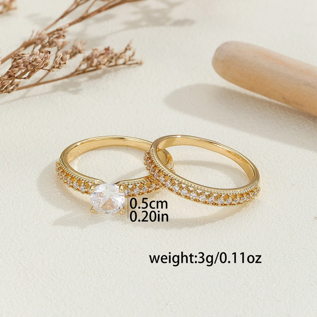 Damenring aus edlem goldfarbenem Metall mit funkelnden Kristallen Shop Nory