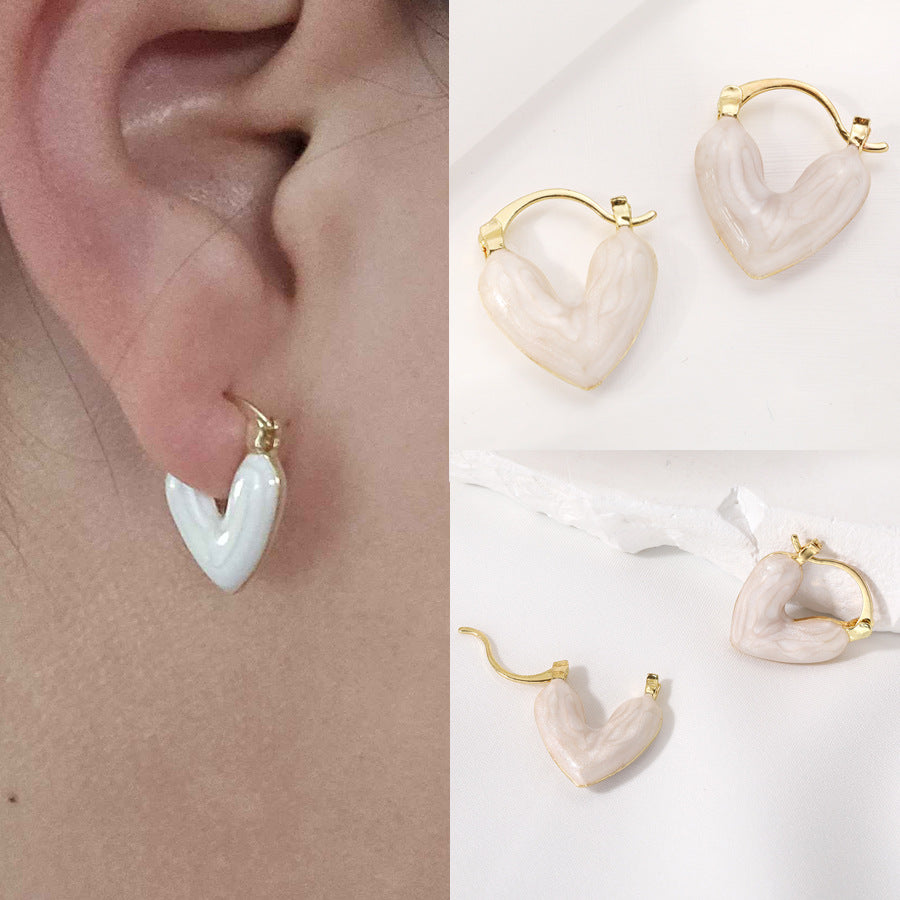 Damen Ohrstecker in Herzform mit elegantem Goldrahmen Shop Nory