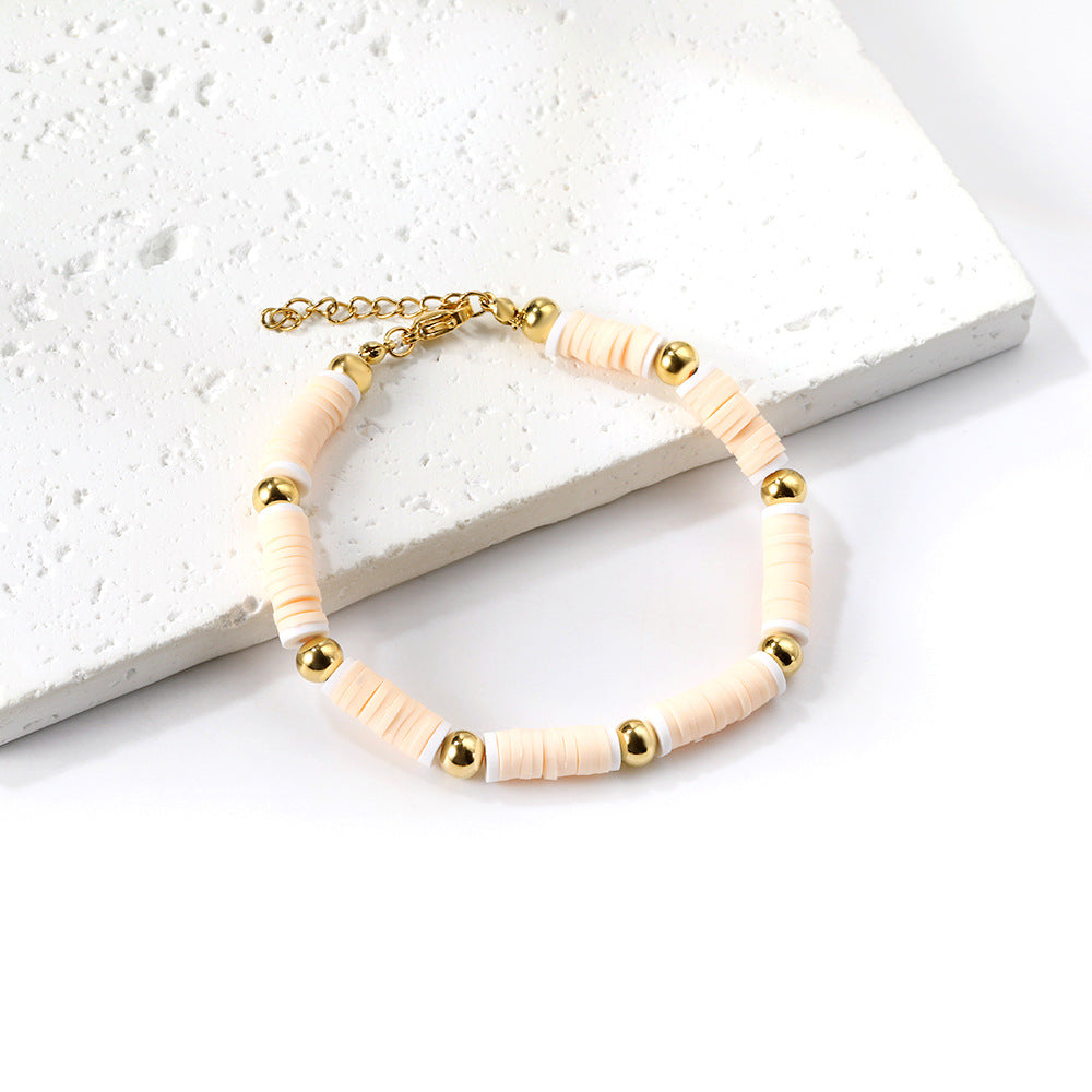 Damen Armband aus hochwertigem Edelstahl mit bunten Perlen und goldplattierten Akzenten Shop Nory