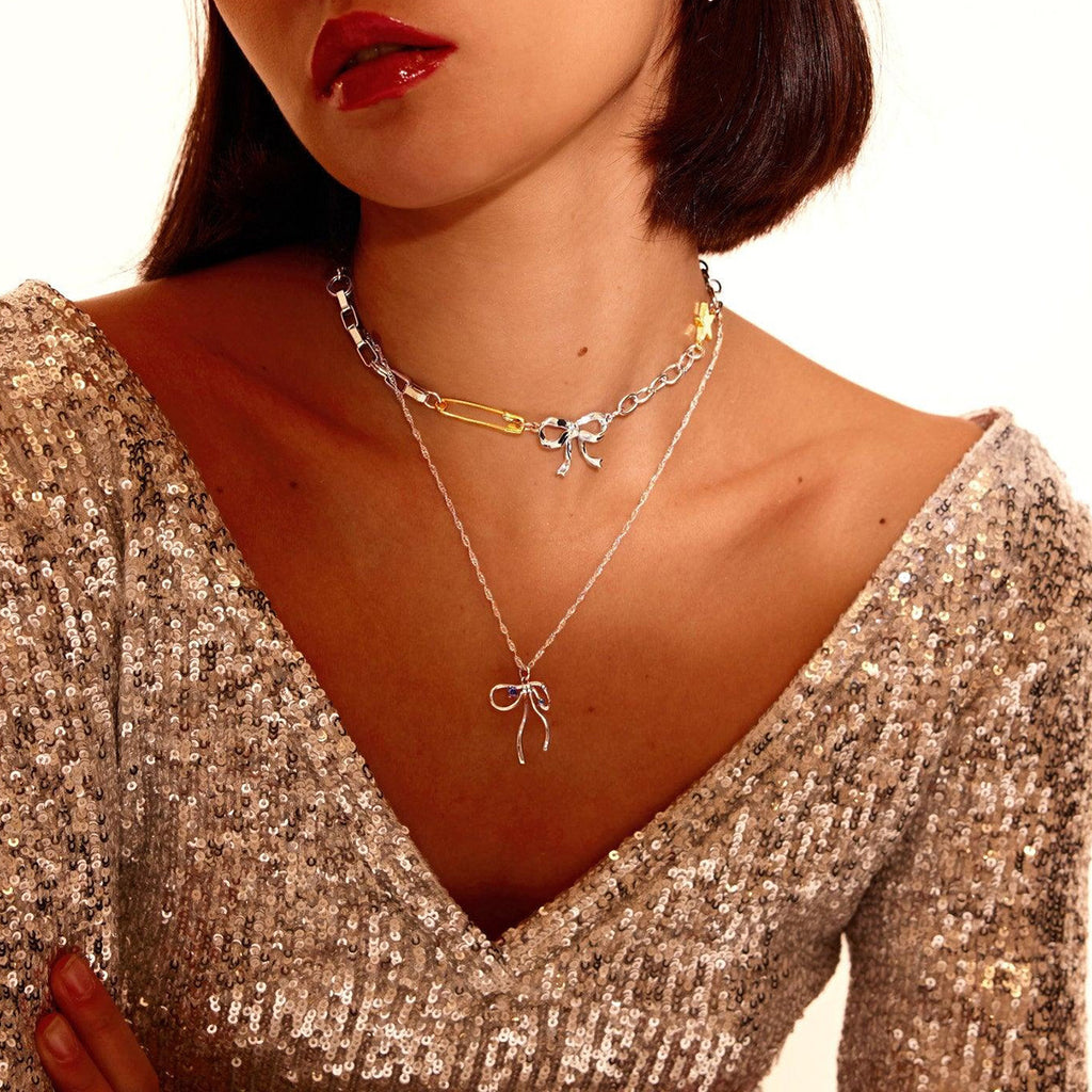Damen Armband mit funkelndem Stern- und Schleifenmotiv aus hypoallergenem Edelstahl Shop Nory