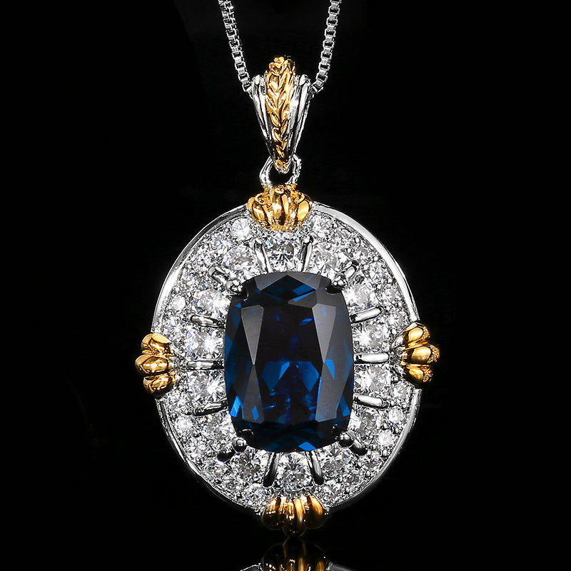 Vintage-inspirierte ovale Halo-Anhänger-Halskette mit simuliertem Saphir-Mittelstück und Pave-Cubic-Zirkonia in zwei Farbtönen Akzenten