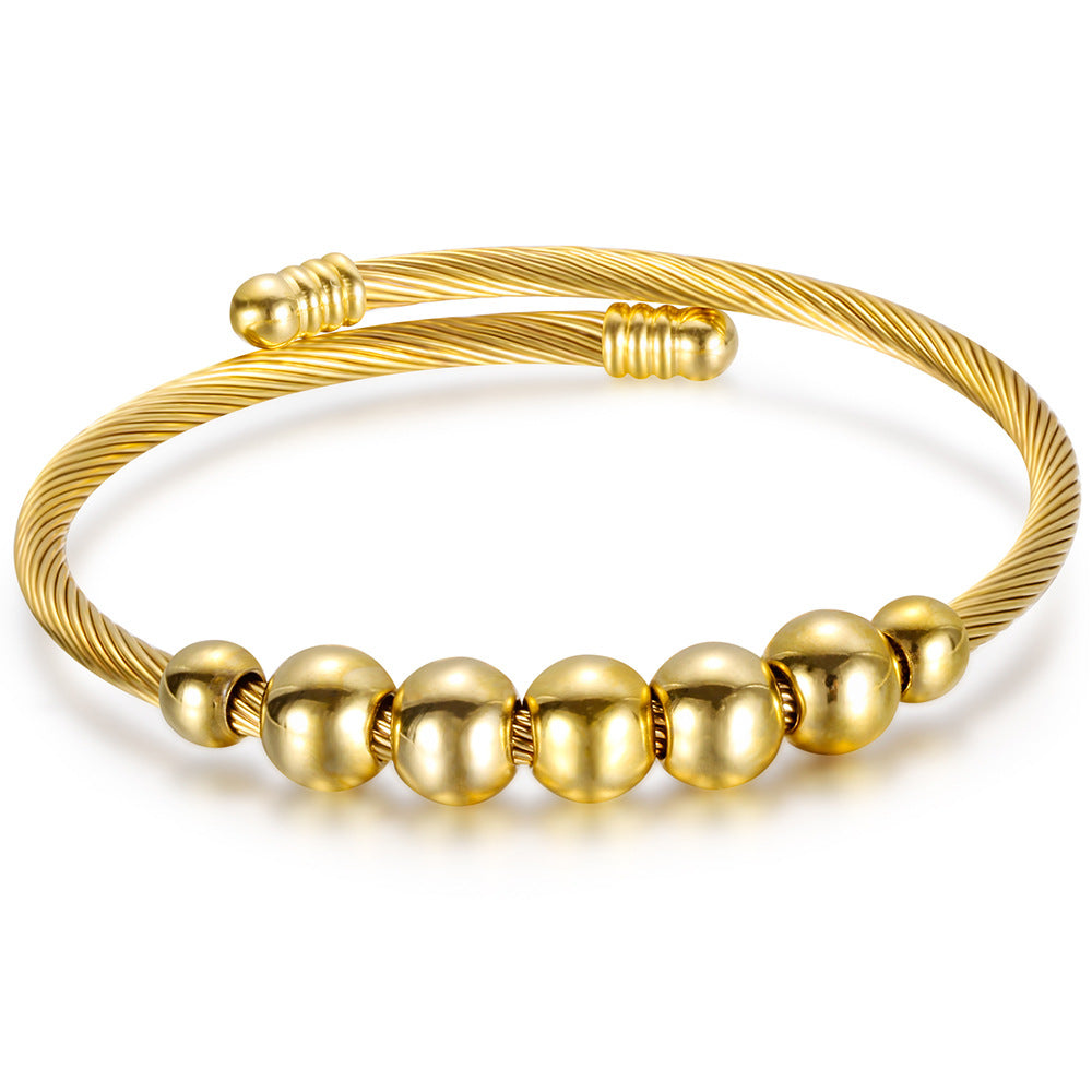 Damen Armreif mit elegantem, geschwungenem Drahtdesign und glänzenden Metallakzenten Shop Nory