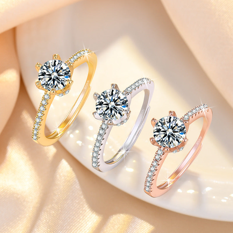 Damenring mit funkelndem Zirkonia und eleganten Goldverzierungen Shop Nory