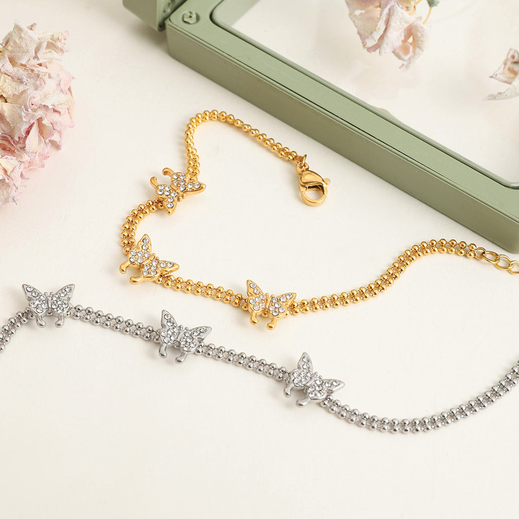Damen Armband mit eleganten Schmetterlingen und funkelnden Kristallen Shop Nory