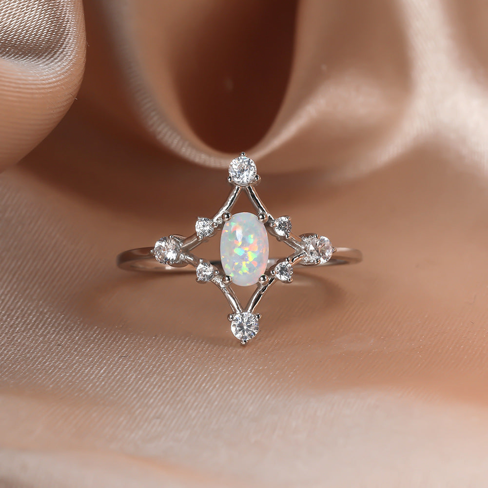 Damen Ring mit funkelnden Zirkonia und schimmerndem Opal-Motiv Shop Nory