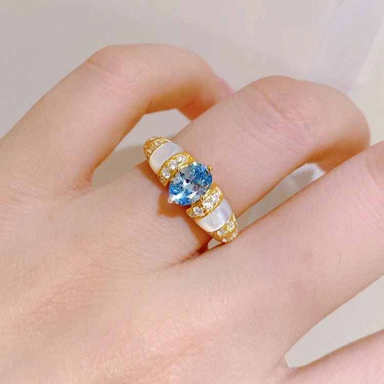 Damenring mit funkelndem Zirkonia und elegantem Perlmuttbesatz Shop Nory