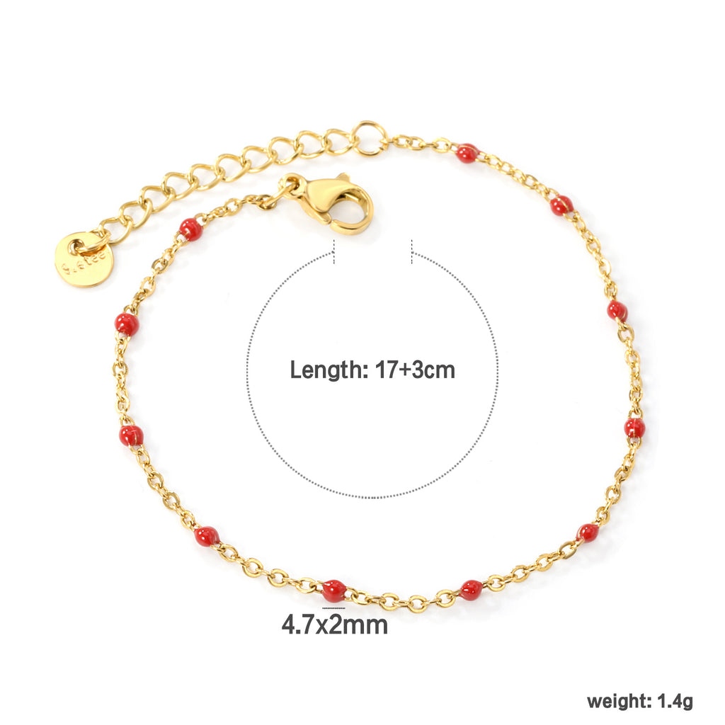 Damen zartes goldplattiertes Armband mit roten Akzenten Shop Nory