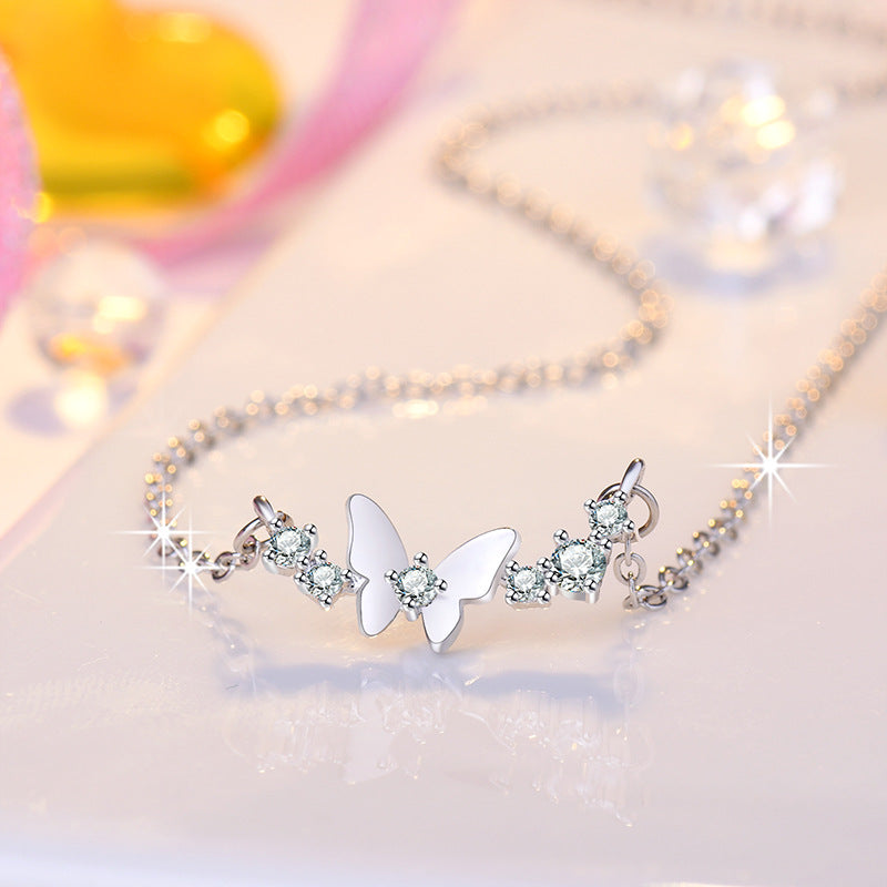 Damen Halskette mit filigranem Schmetterlingsdesign und funkelnden Zirkonia Shop Nory