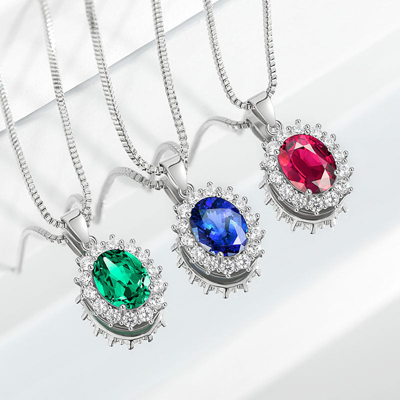 Damen Halskette mit funkelndem Smaragdanhänger und umrahmenden Kristallen Shop Nory