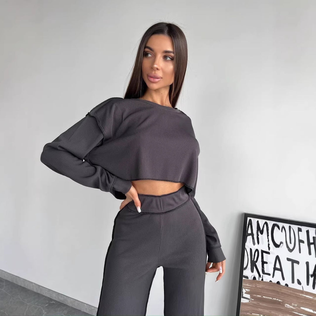 Damen Cropped Oversized-Sweatshirt mit Overlocknähten und High-Waist ausgestellter Hose Set Shop Nory