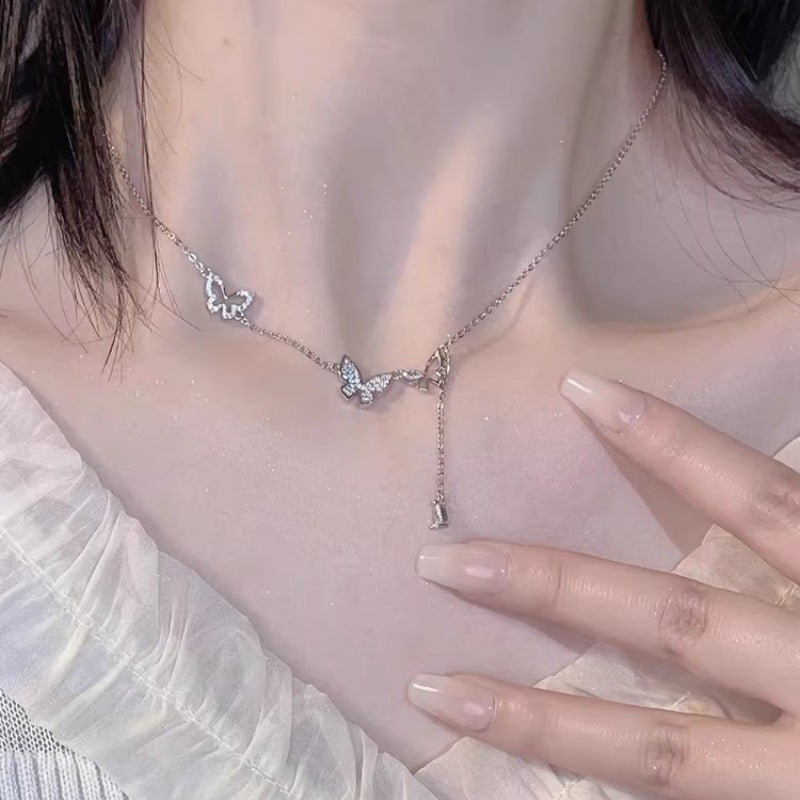 Damen Halskette mit kunstvoll gestalteten Schmetterlingsanhängern Shop Nory