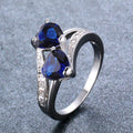 Damen Ring mit zwei herzförmigen blauen Zirkonen und funkelnden Zirkonia-Details Shop Nory