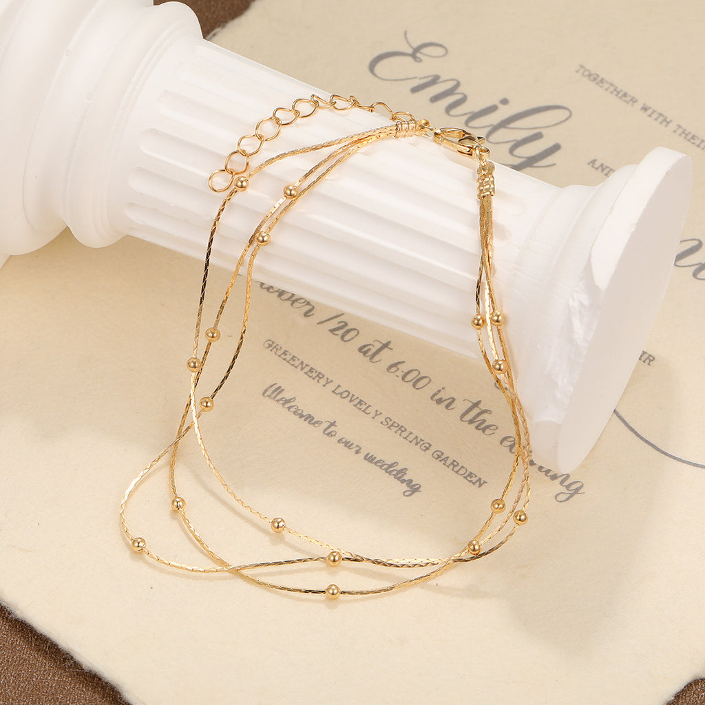Damen Fußkettchen mit eleganten, goldenen Akzenten Shop Nory