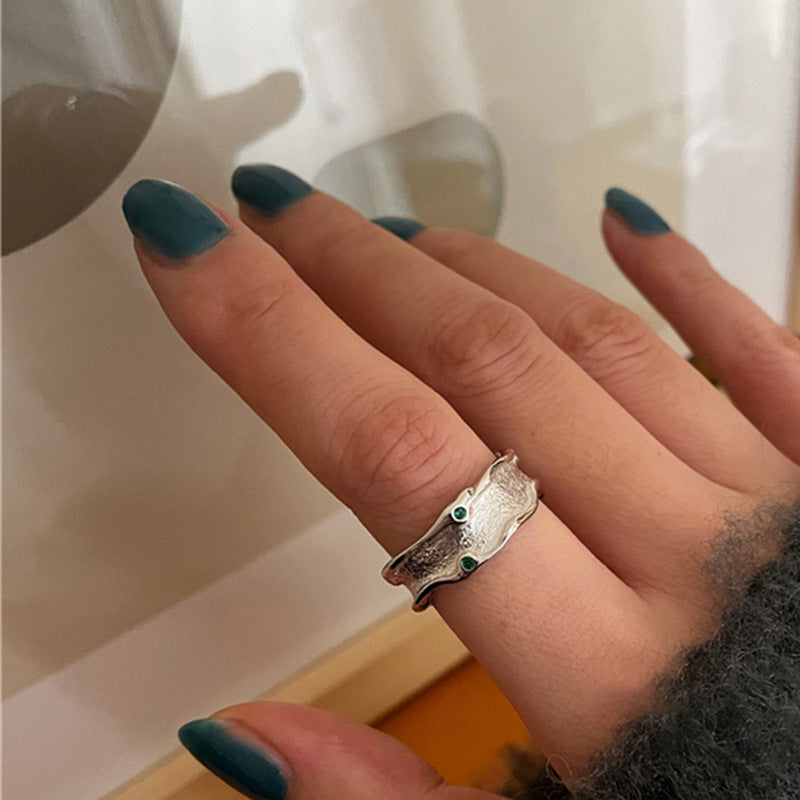 Damenring mit kunstvollem Design und funkelnden blauen Steinen Shop Nory