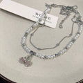 Damen Halskette mit zarten Perlen und funkelndem Herzanhänger Shop Nory