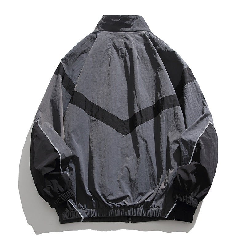 [Unisex] Oversize technische Wind- und Regenjacke mit Stehkragen, reflektierenden Paspeln und elastischem Saum Shop Nory