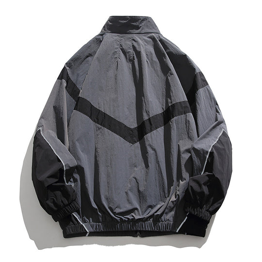 [Unisex] Oversize technische Wind- und Regenjacke mit Stehkragen, reflektierenden Paspeln und elastischem Saum Shop Nory