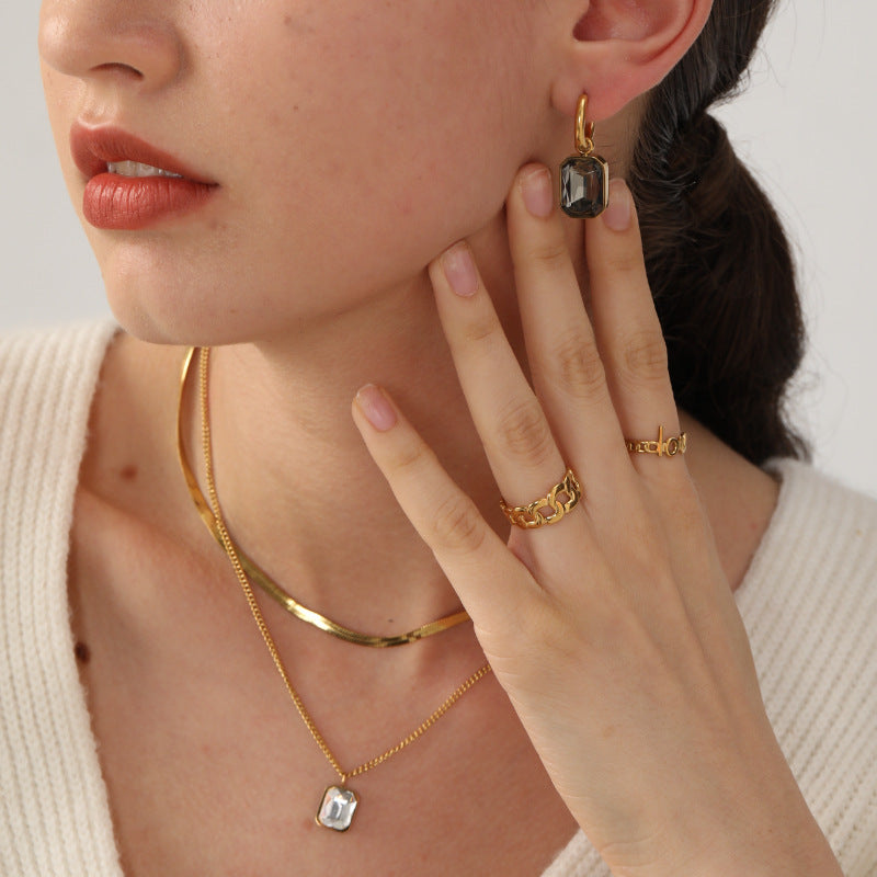 Damen Edelstahl Ohrhänger mit funkelnden Zirkonia und goldplattiertem Design Shop Nory