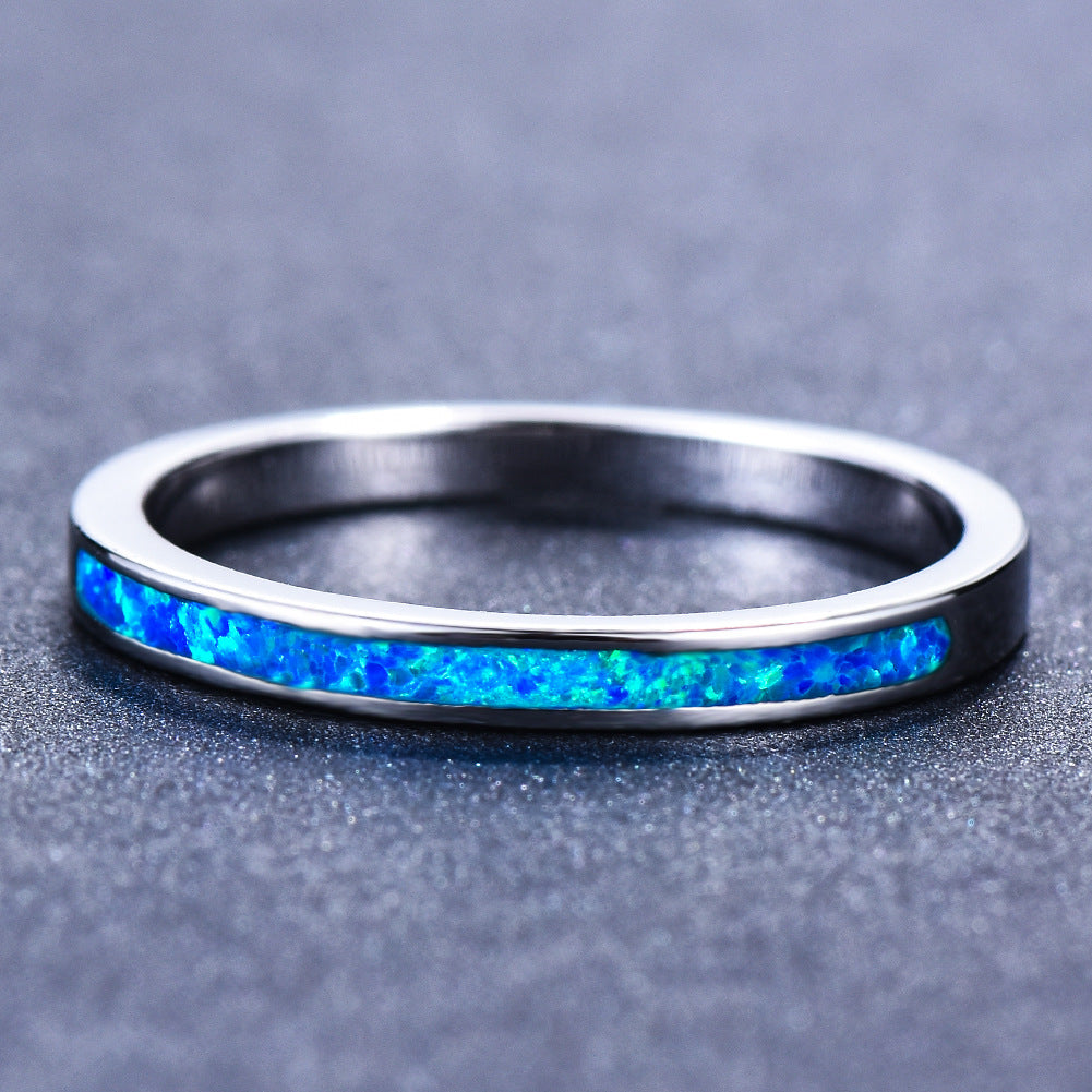 Damen Ring mit schimmerndem Opal und eleganter Edelstahlfassung Shop Nory