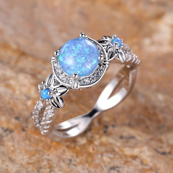 Damen Ring mit filigranem Opalmotiv und funkelnden Zirkonia Shop Nory
