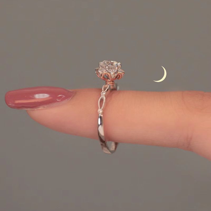Damen eleganter Ring mit filigranem Design und funkelndem Hauptstein Shop Nory