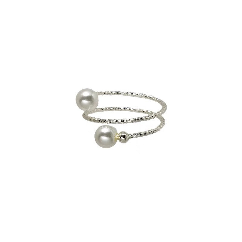 Damen Ring mit zartem Perlendesign und modernem, skulpturalem Rahmen Shop Nory