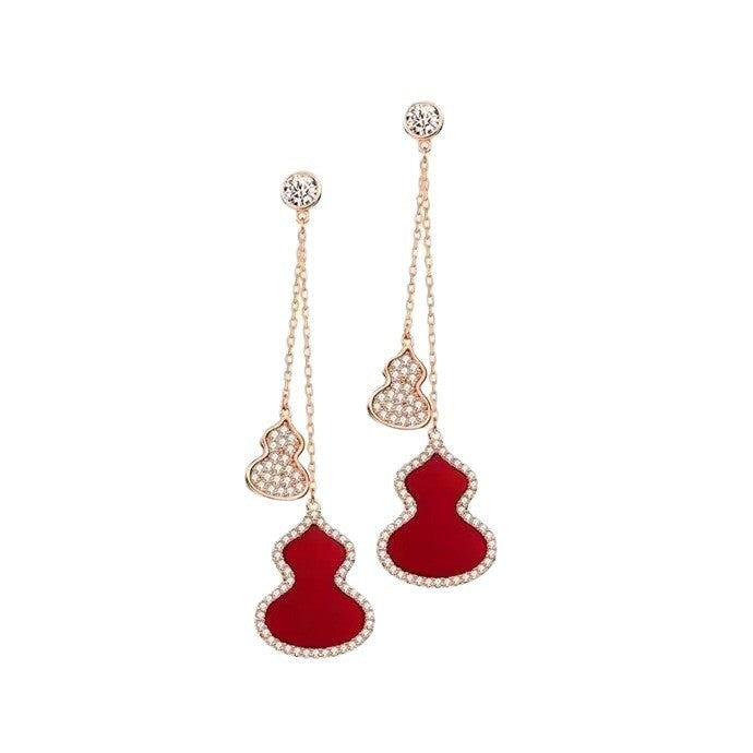 Damen Ohrringe mit kunstvollem Design und funkelndem Zirkonia Shop Nory