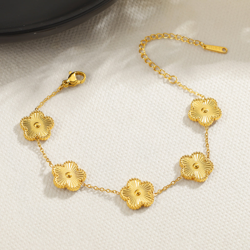 Damen zierliches Blumenarmband mit goldenen Details Shop Nory