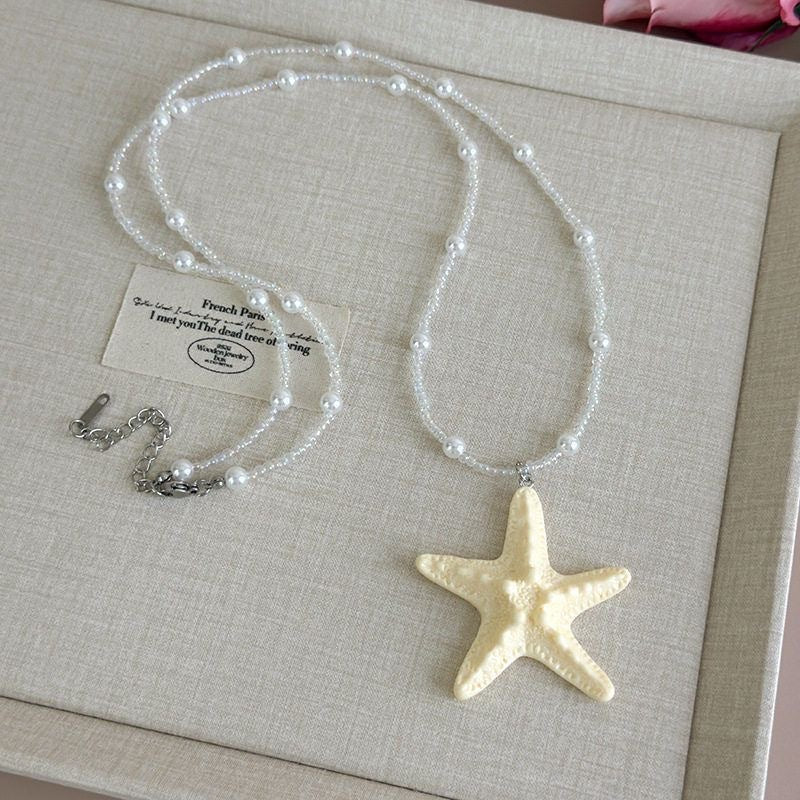 Damen Kette mit einzigartigem Sternenanhänger und buntem Perlenmuster Shop Nory