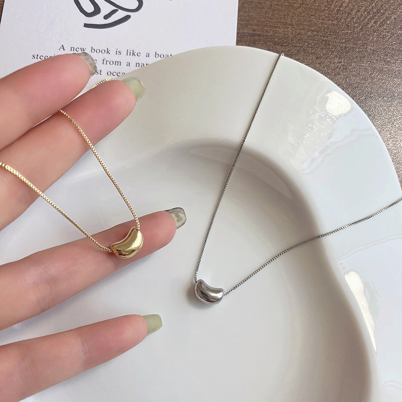 Damen Halskette mit modernem Bohnenanhänger aus hochwertigem Edelstahl Shop Nory