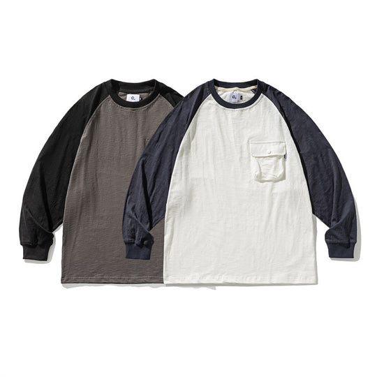 Unisex Lässiges Raglan-Longsleeve mit Kontrastärmeln und aufgesetzter Klappentasche Shop Nory