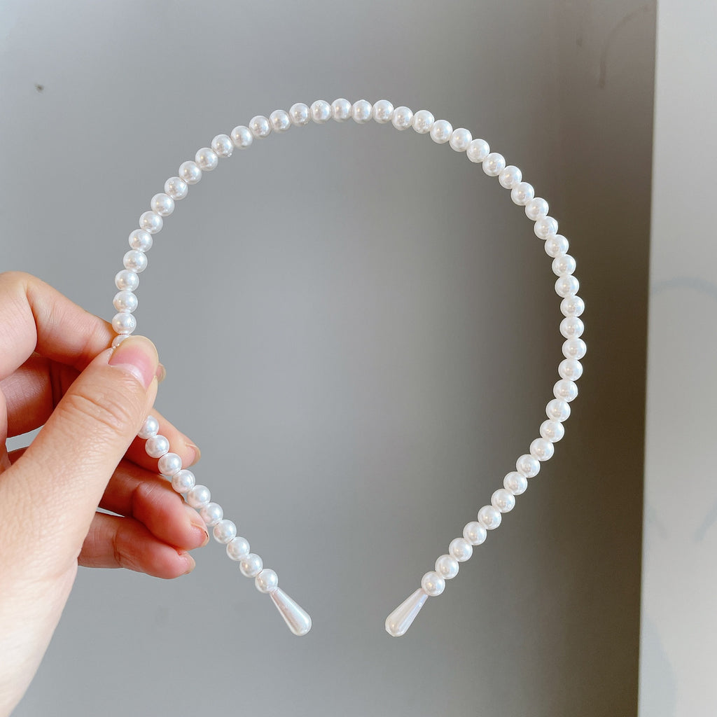 Damen Haarband mit eleganten Perlenakzenten Shop Nory