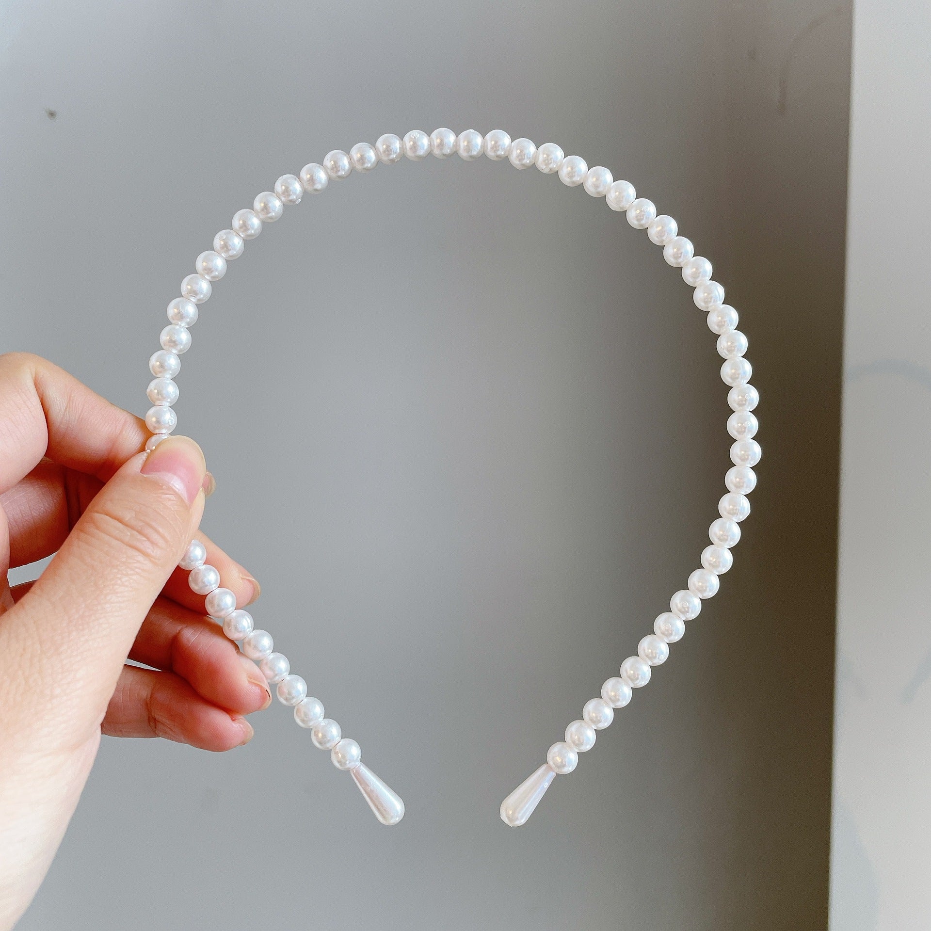 Damen Haarband mit eleganten Perlenakzenten Shop Nory
